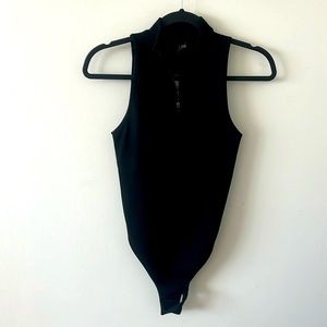 Brand New knit zippered body suit.